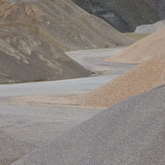 Different kinds of stone on a gravel quarry. Construction background